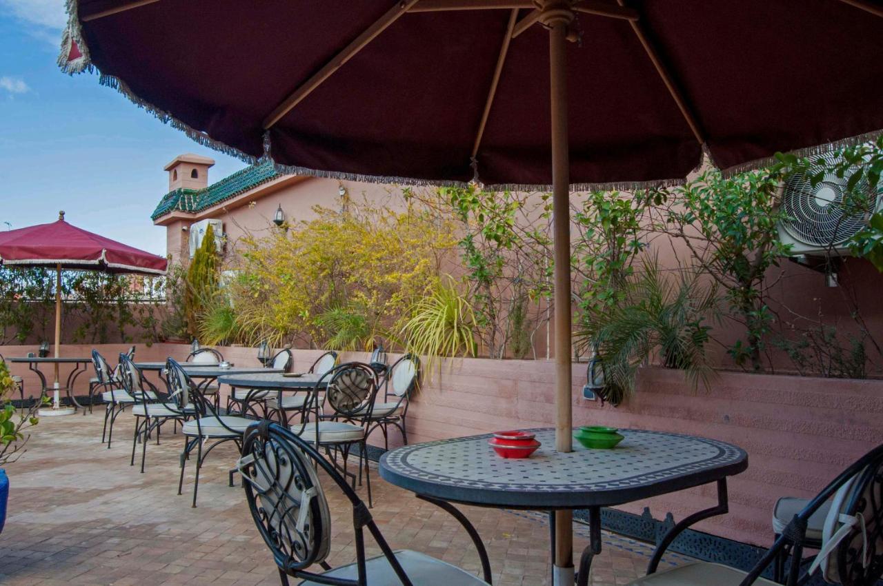 Riad Merzouga Marrakesh Exterior photo A patio umbrella
