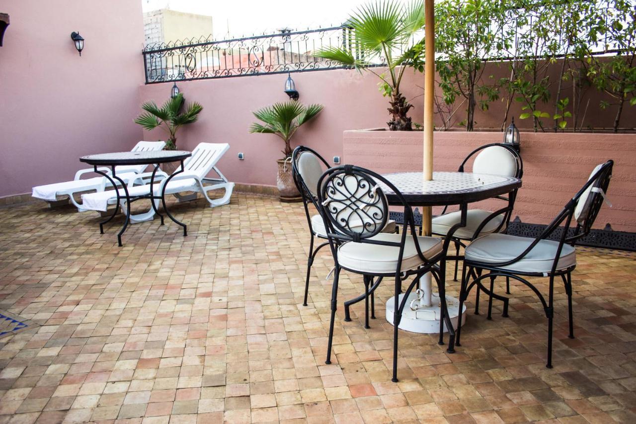 Riad Merzouga Marrakesh Exterior photo A terrace in Morocco